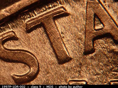 Die-stage B marker on 1997P•1DR•002 (1997 Doubled Die Reverse).