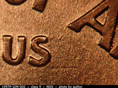 Die-stage B marker on 1997P•1DR•002 (1997 Doubled Die Reverse).
