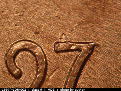Die-stage B marker on 1997P•1DR•002 (1997 Doubled Die Reverse).