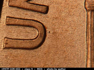 Die-stage B marker on 1997P•1DR•003 (1997 Doubled Die Reverse).