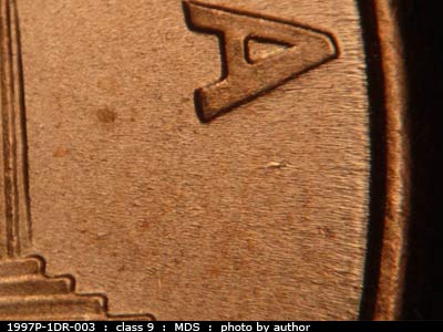 Die-stage B marker on 1997P•1DR•003 (1997 Doubled Die Reverse).