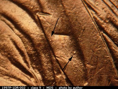 Die-stage B marker on 1997P•1DR•003 (1997 Doubled Die Reverse).
