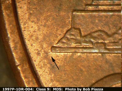 Die-stage B marker on 1997P•1DR•004 (1997 Doubled Die Reverse).