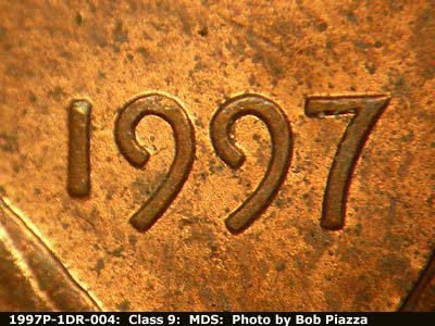 Die-stage B marker on 1997P•1DR•004 (1997 Doubled Die Reverse).