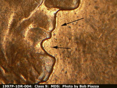 Die-stage B marker on 1997P•1DR•004 (1997 Doubled Die Reverse).