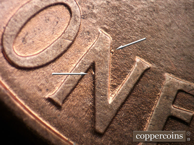 Die-stage B marker on 1998D•1DR•005 (1998 Doubled Die Reverse).