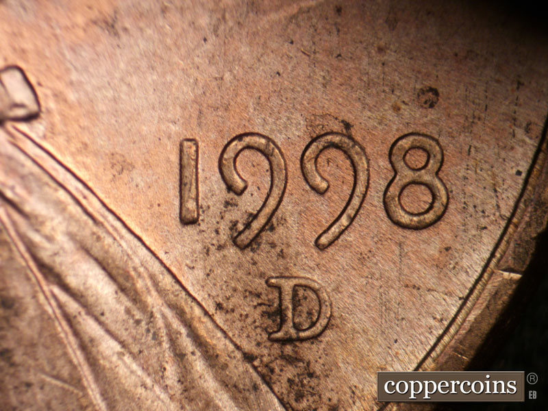 Die-stage B marker on 1998D•1DR•006 (1998 Doubled Die Reverse).