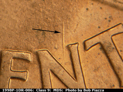 Die-stage B marker on 1998P•1DR•006 (1998 Doubled Die Reverse).