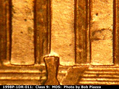 Die-stage B marker on 1998P•1DR•011 (1998 Doubled Die Reverse).