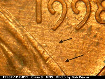 Die-stage B marker on 1998P•1DR•011 (1998 Doubled Die Reverse).
