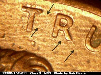 Die-stage B marker on 1998P•1DR•011 (1998 Doubled Die Reverse).