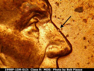 Die-stage B marker on 1998P•1DR•013 (1998 Doubled Die Reverse).