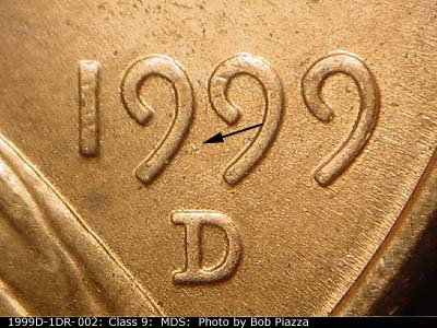 Die-stage B marker on 1999D•1DR•002 (1999 Doubled Die Reverse).