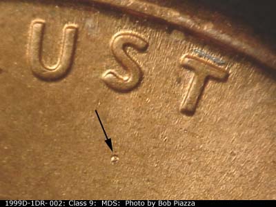 Die-stage B marker on 1999D•1DR•002 (1999 Doubled Die Reverse).