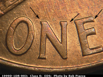 Die-stage A marker on 1999D•1DR•003 (1999 Doubled Die Reverse).
