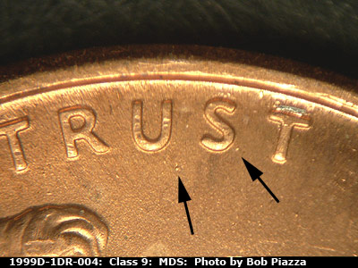 Die-stage B marker on 1999D•1DR•004 (1999 Doubled Die Reverse).