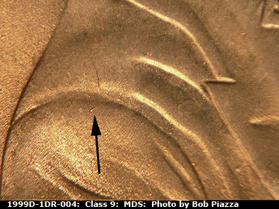 Die-stage B marker on 1999D•1DR•004 (1999 Doubled Die Reverse).
