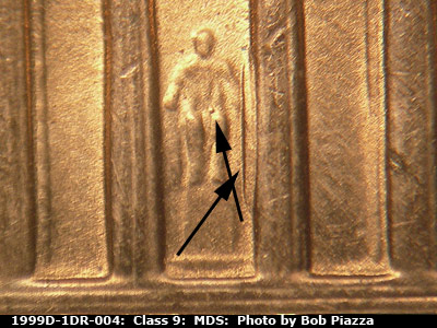 Die-stage B marker on 1999D•1DR•004 (1999 Doubled Die Reverse).