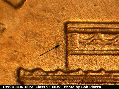 Die-stage B marker on 1999D•1DR•005 (1999 Doubled Die Reverse).