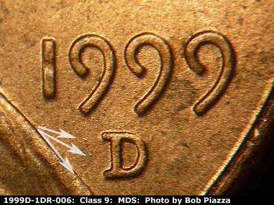 Die-stage B marker on 1999D•1DR•006 (1999 Doubled Die Reverse).