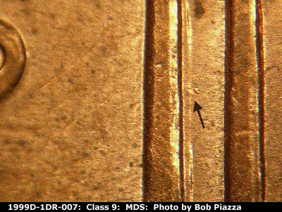 Die-stage B marker on 1999D•1DR•007 (1999 Doubled Die Reverse).