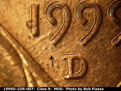 Die-stage B marker on 1999D•1DR•007 (1999 Doubled Die Reverse).