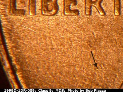 Die-stage B marker on 1999D•1DR•009 (1999 Doubled Die Reverse).