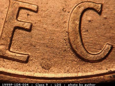 Die-stage C marker on 1999P•1DR•004 (1999 Doubled Die Reverse).