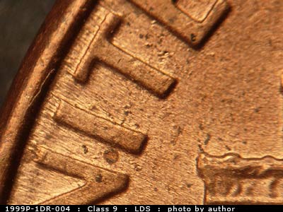 Die-stage C marker on 1999P•1DR•004 (1999 Doubled Die Reverse).