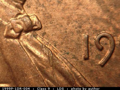 Die-stage C marker on 1999P•1DR•004 (1999 Doubled Die Reverse).