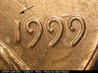 Die-stage B marker on 1999P•1DR•005 (1999 Doubled Die Reverse).