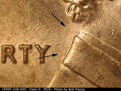 Die-stage B marker on 1999P•1DR•005 (1999 Doubled Die Reverse).