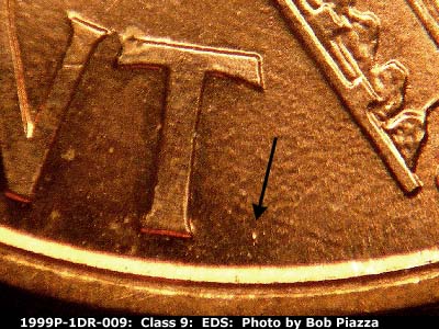 Die-stage A marker on 1999P•1DR•009 (1999 Doubled Die Reverse).