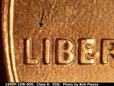 Die-stage A marker on 1999P•1DR•009 (1999 Doubled Die Reverse).