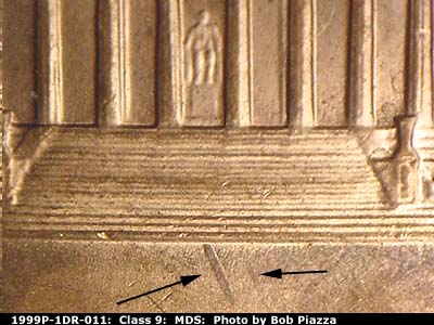 Die-stage B marker on 1999P•1DR•011 (1999 Doubled Die Reverse).