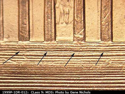 Die-stage B marker on 1999P•1DR•012 (1999 Doubled Die Reverse).