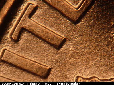 Die-stage B marker on 1999P•1DR•014 (1999 Doubled Die Reverse).