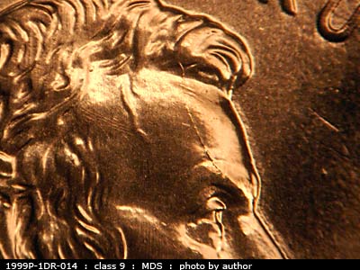 Die-stage B marker on 1999P•1DR•014 (1999 Doubled Die Reverse).