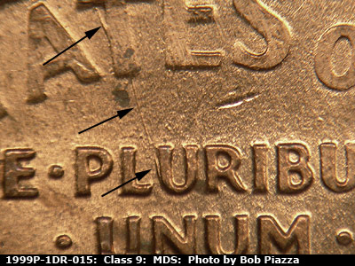 Die-stage B marker on 1999P•1DR•015 (1999 Doubled Die Reverse).