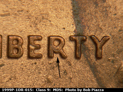 Die-stage B marker on 1999P•1DR•015 (1999 Doubled Die Reverse).