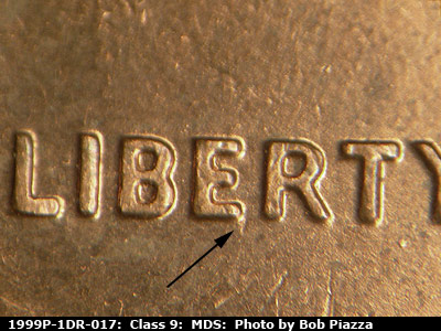 Die-stage B marker on 1999P•1DR•017 (1999 Doubled Die Reverse).