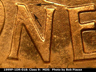 Die-stage B marker on 1999P•1DR•018 (1999 Doubled Die Reverse).