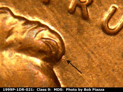 Die-stage B marker on 1999P•1DR•021 (1999 Doubled Die Reverse).