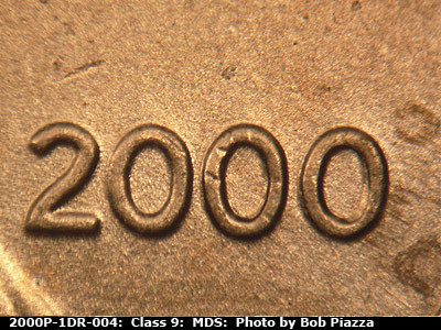 Die-stage B marker on 2000P•1DR•004 (2000 Doubled Die Reverse).