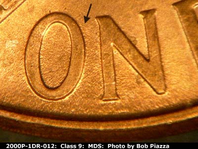 Die-stage B marker on 2000P•1DR•012 (2000 Doubled Die Reverse).