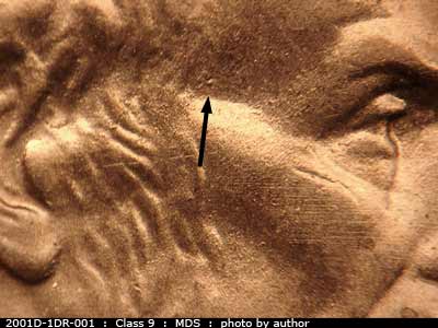 Die-stage B marker on 2001D•1DR•001 (2001 Doubled Die Reverse).