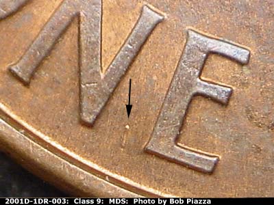 Die-stage B marker on 2001D•1DR•003 (2001 Doubled Die Reverse).