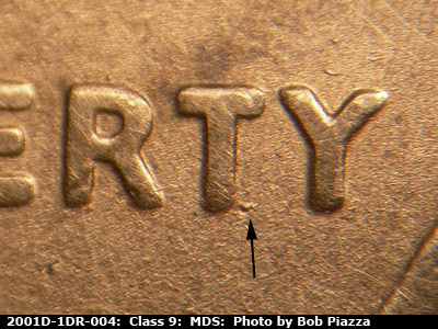 Die-stage B marker on 2001D•1DR•004 (2001 Doubled Die Reverse).