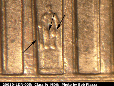 Die-stage B marker on 2001D•1DR•005 (2001 Doubled Die Reverse).