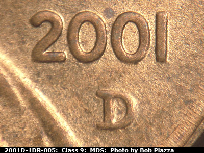 Die-stage B marker on 2001D•1DR•005 (2001 Doubled Die Reverse).